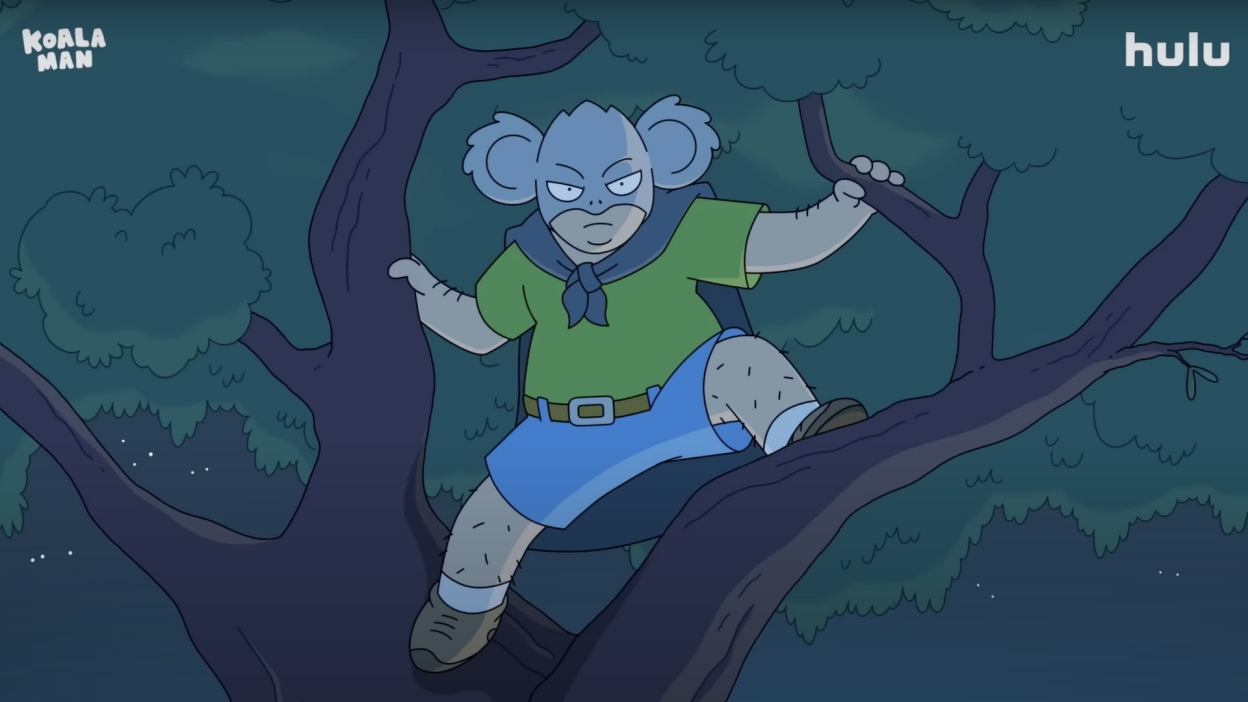 A cartoon shows a man dressed as a koala in a tree.