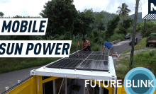 A mobile nanogrid with solar panels on the rooftop has stopped on a road near a forest. Caption reads" 'Mobile sun power."