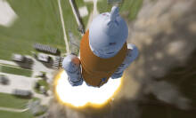 the SLS rocket blasting into space