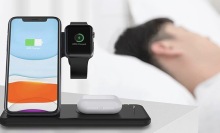 Person sleeping next to their Four-In-One Wireless Charger Stand.