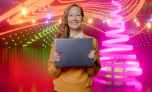 A woman holds the Acer Chromebook