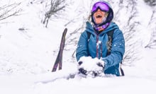 Skier laughing in snow