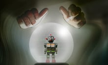 Two hands hovering over a crystall ball with a robot inside