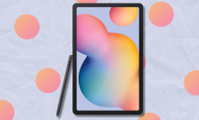 Samsung Galaxy Tab S6 Lite with S Pen on light blue background with orange dots