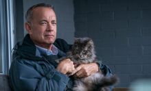 Tom Hanks cuddles a cat in "A Man Called Otto."