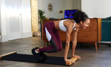 woman using brrrn board to exercise