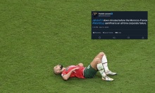 morocco player laying on grass in world cup and screenshot of tweet about fubotv being down