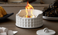 colosseum tabletop fire pit on top of table with s'mores