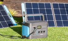 homepower one solar generator with portable solar panels in yard