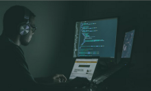 person coding on computer