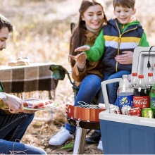 A family using the Knox Gear Electric Cooler And Warmer in the woods.