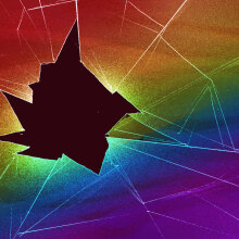 An illustration of shattered glass that bears the LGBTQ pride rainbow colors. 