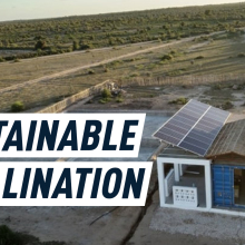 Picture of a deserted field. On the right there is a little white water desalination hub with solar powers on its roof. On the left, there's a Mashable caption reading "Sustainable desalination."