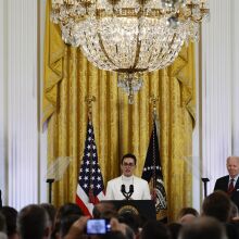 Florida student and gay activist Javier Gomez stands at the podium at a White House Pride Month celebration event with President Joe Biden.