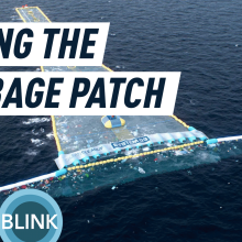 The Ocean Cleanup's rendering of the system 03 artificial coastline collecting trash in the North Pacific Ocean