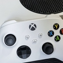xbox controller propped against the xbox series s 
