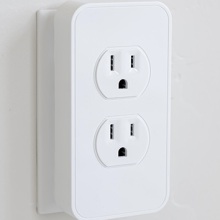 The Switchmate Power: Dual Smart Power Outlet plugged into an outlet.