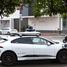 a Waymo autonomous car on San Francisco's Masonic Avenue in 2022.