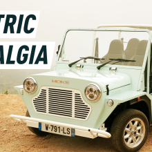An image portraying a mint-coloured e-Moke parked on a cliff. Caption reads: "Electric Nostalgia"