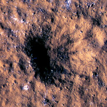 Martian crater exposing underground ice