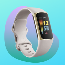 Fitbit Charge 5 white and gold fitness tracker