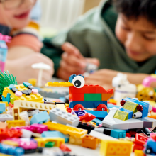 kids playing with legos on a table