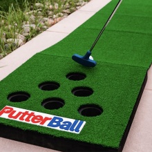 Person playing the PutterBall Backyard Golf Game.