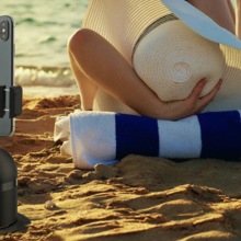 Person at the beach using the 3-in-1 360⁰ Self Videographer.