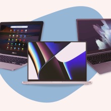 Three laptops featured in amazon's early black friday sale against a blue and pink geometric background.