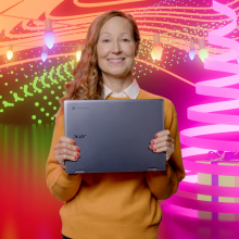 A woman holds the Acer Chromebook