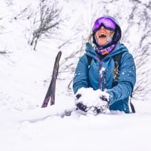 Skier laughing in snow