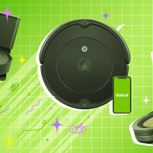 Three Roomba robot vacuums on green tiled background