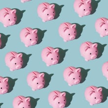 Pattern made of piggy bank on blue background