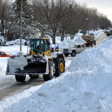 A snowplow plowing in Buffalo, NY