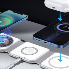 magstack foldable charger on desk with two phones and airpods charging on it