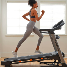 Woman running on NordicTrack treadmill