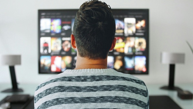 man watching movies on streaming service