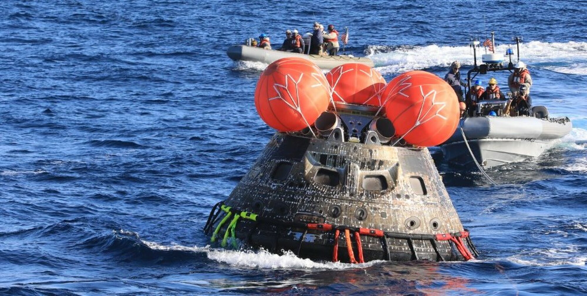 Navy divers recovering the Orion spacecraft