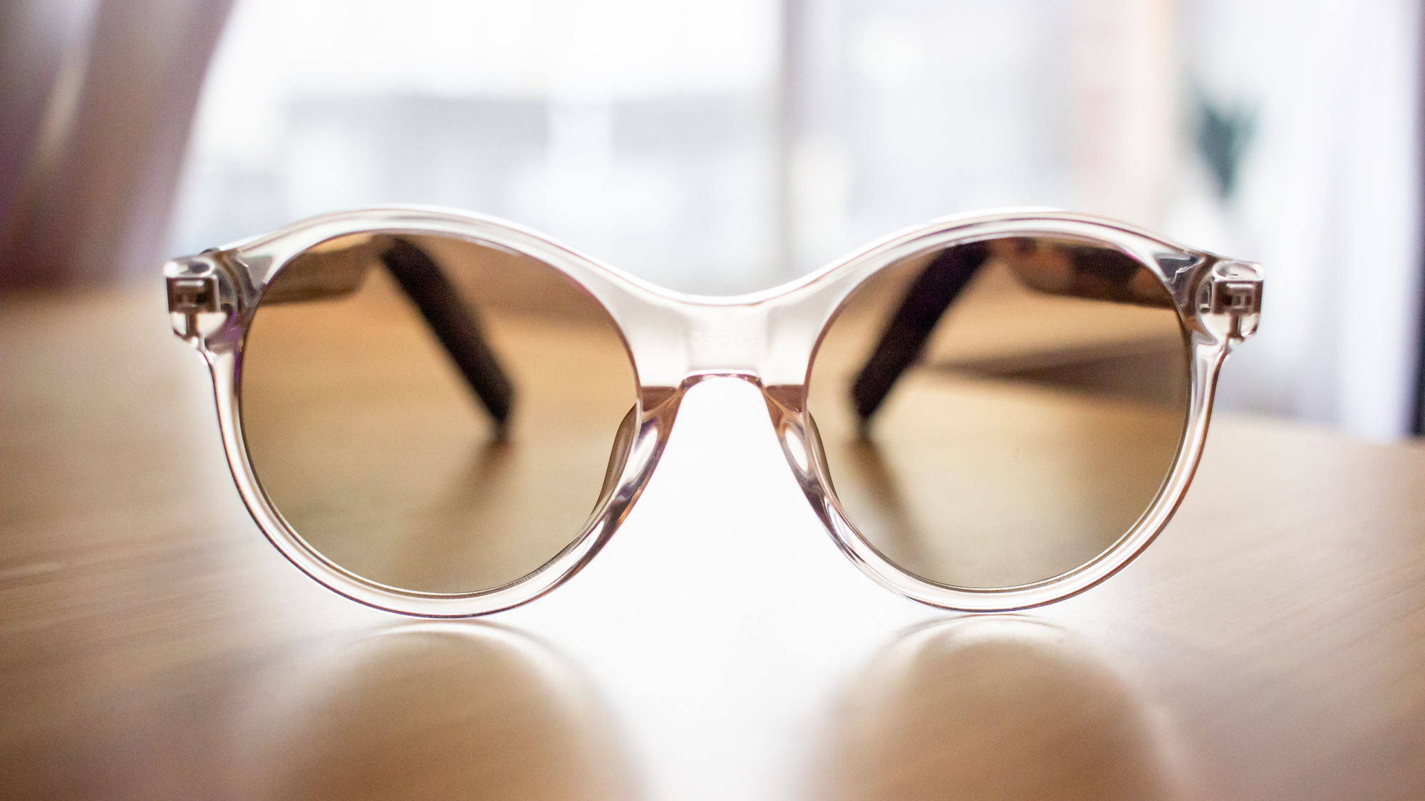 A pair of sunglasses resting on a flat surface