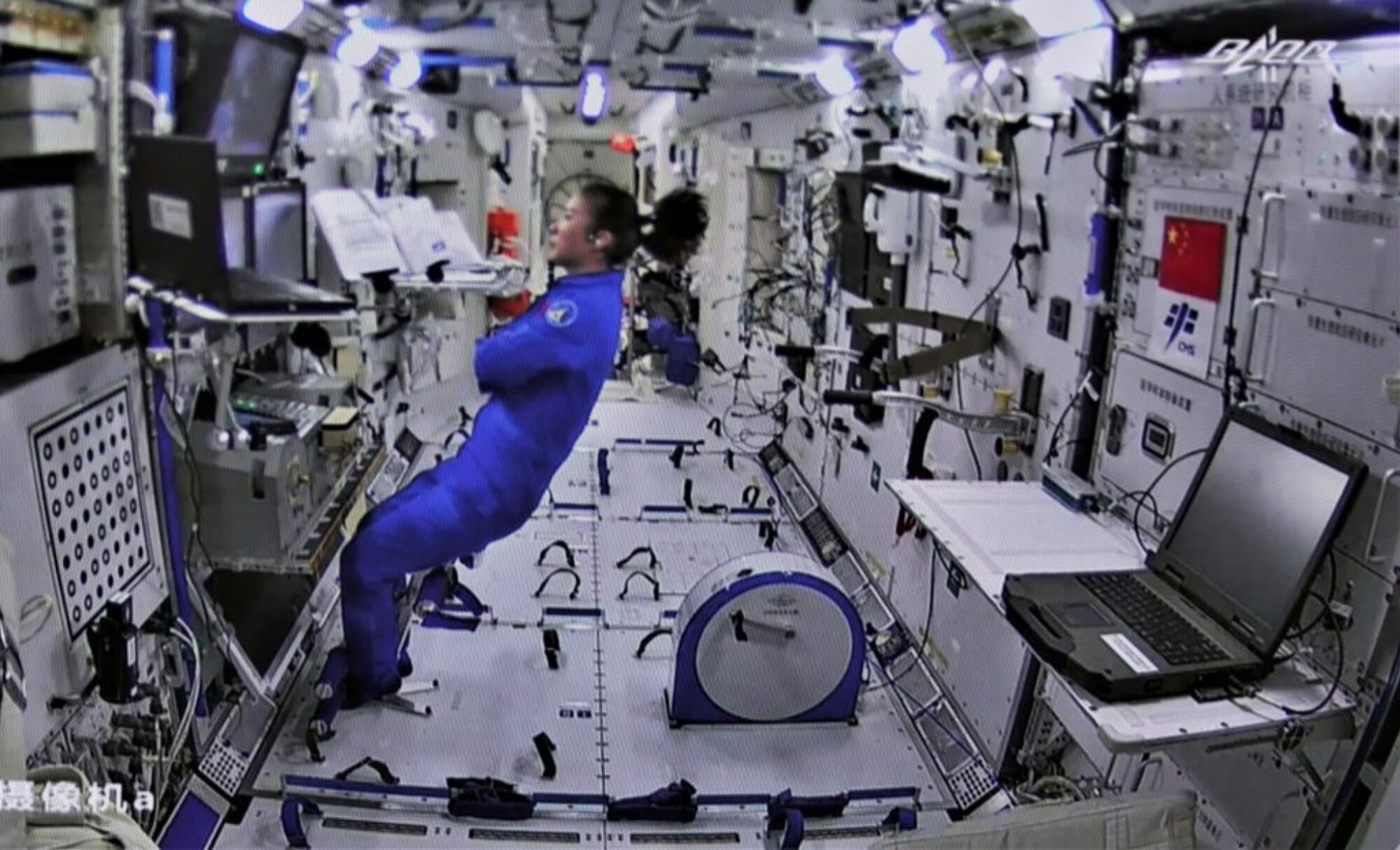 Taikonauts working inside Chinese space station