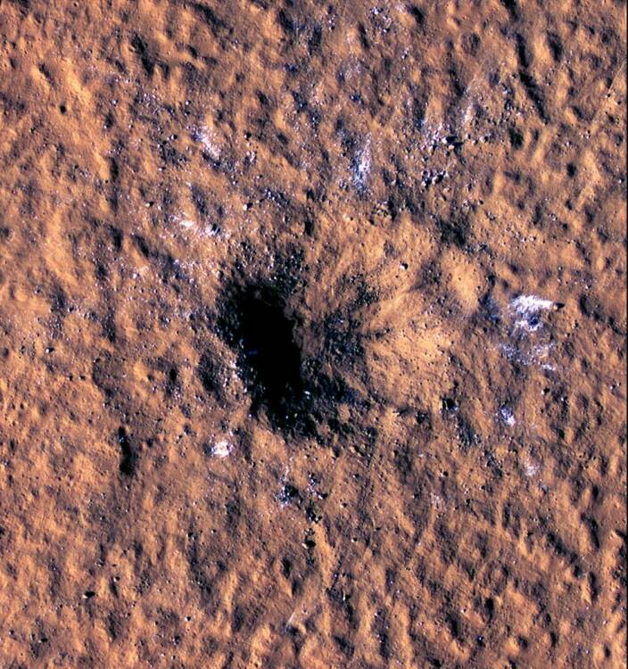 A large crater on Mars created by a meteoroid impact.