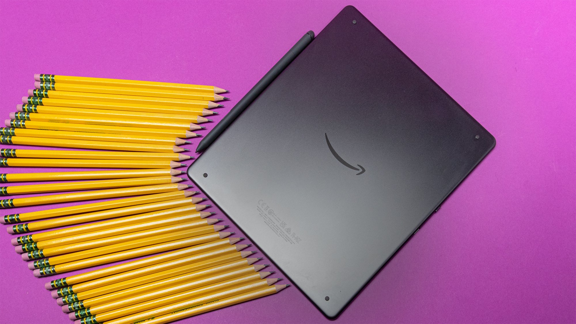 Kindle Scribe flanked by pencils