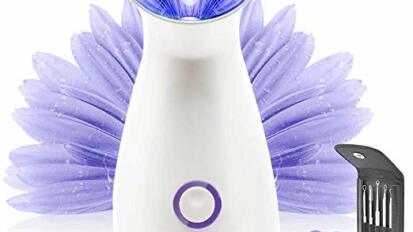 White facial steamer with lavender petals behind it and black pimple-popping kit beside it