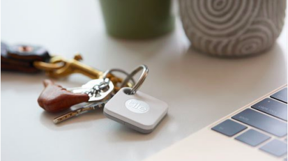 White square tile tracker attached to keyring