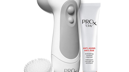 White facial cleansing brush with tube of cleanser and brush
