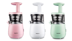 Small pink, white, and green juicers next to each other